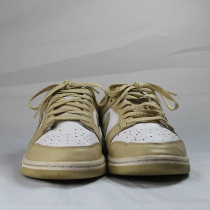 Nike Dunk Low Retro Gold, edição clássica com detalhes dourados, estilo icónico e confortável, disponíveis na Newold para os amantes de sneakers.